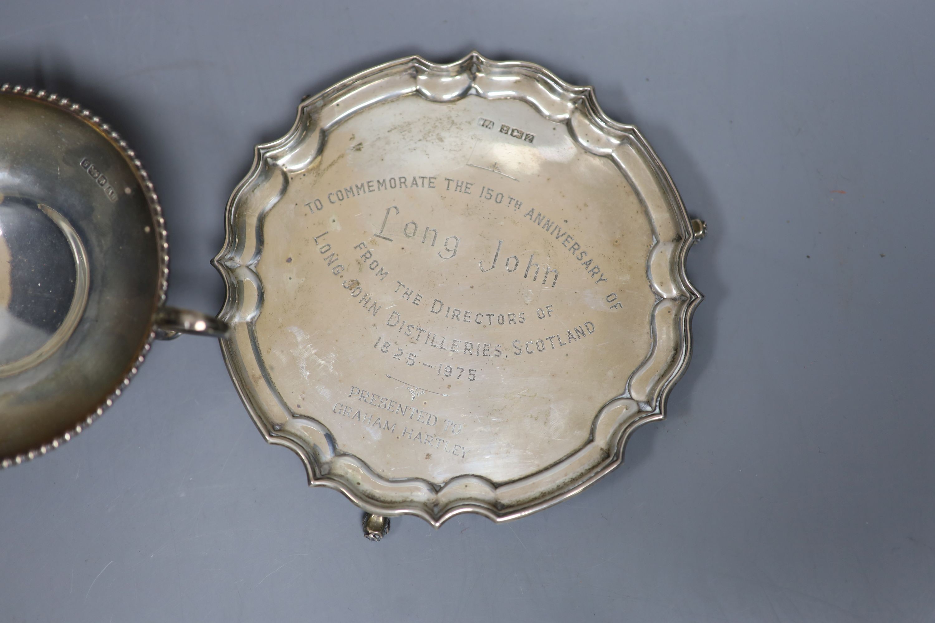 A modern silver presentation waiter, 15.5cm and a George V silver tri-handles bowl, 9oz.